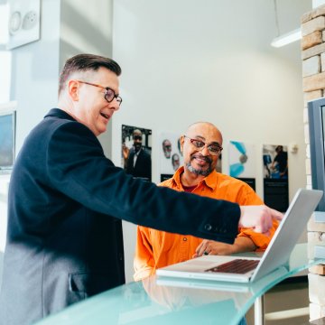 two people looking at onboarding materials in the office